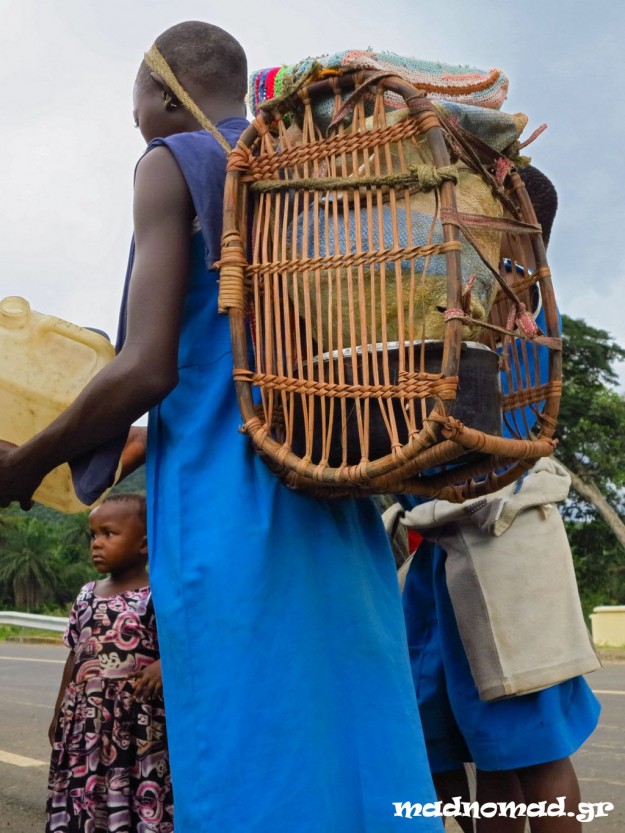 The school bags of the pupils in the countryside are made out of bamboo and they carry them hanging against their forehead.